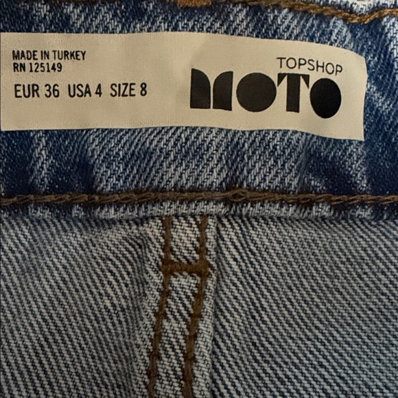 Topshop Denim Skirt is a blue mini skirt raw hem and five-pocket styling size 8 - Picture 2 of 3